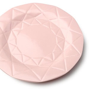 Kolorowa ceramiczna miseczka w różowym odcieniu z geometrycznym wzorem na powierzchni, idealna do serwowania deserów i przekąsek w domu.